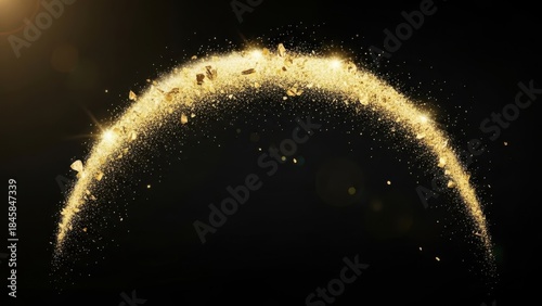 Sparkling arc of golden glitter particles and dust on a black background