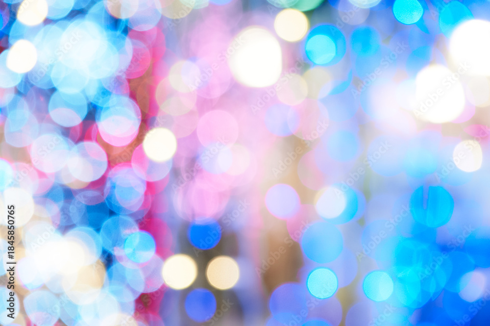 Obraz premium A soft, out-of-focus collage of blue, pink, and warm lights creates a dynamic, festive atmosphere. Ideal as a decorative background for events, promotions, or technology and lifestyle themes.