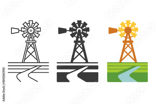 Windmill Over Farmland. Metal wind pump structure standing over irrigation ditch in flat farmland, first in line style with thin