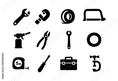 A collection of black silhouette icons representing various essential hand tools and repair equipment on a white background — stock vector.