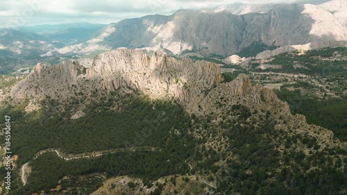 Stunning aerial landscape of Puig Campana mountain in Costa Blanca, Spain, ideal for hiking, nature, travel, and adventure backgrounds or tourism promotion.