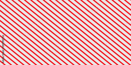 Red and pink Christmas seamless pattern. Candy cane diagonal stripes background. Repeating decoration wallpaper. Winter holidays lines backdrop. Xmas peppermint present wrapping print design. Vector
