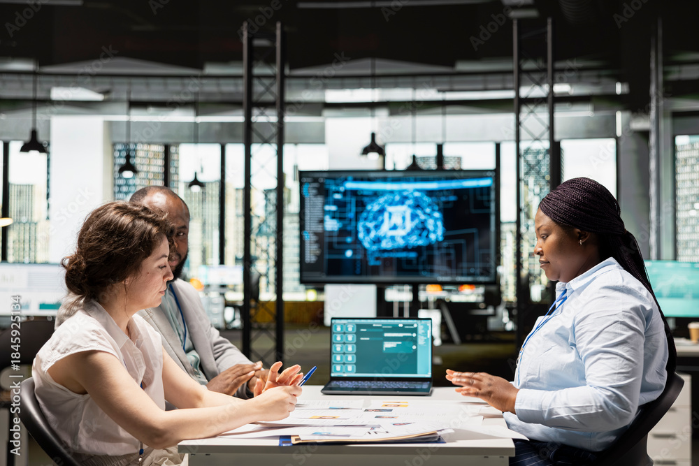 Fototapeta premium Artificial intelligence supporting HR team as they review digital candidates profiles, applying algorithmic filtering and using automation to enhance decision making after the interview.