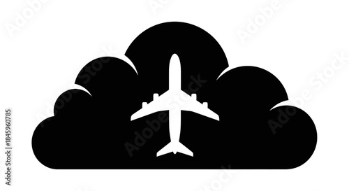 Airplane silhouette flying through a cloud.