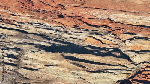 Aerial View of Valley of Fire State Park in Nevada outside of Las Vegas With Stunning Colorful Rock Formations and Rugged Landscape during Golden hour Sunset - 4K Drone