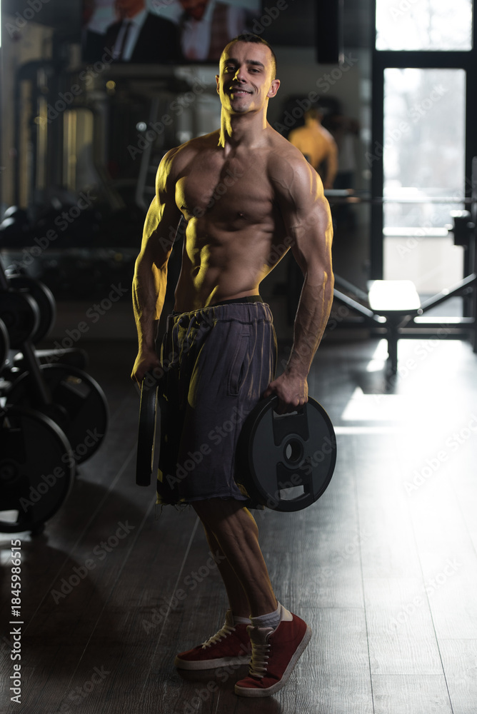 Obraz premium Healthy Man Workout Abs With Weights