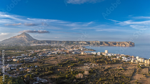 Javea Spain 15 12 2025 - Aerial drone sunset view of Cabo San Antonio, Montgo massif, and El Arenal beach along the Mediterranean coast.