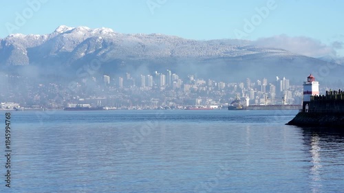North Vancouver from Brockton Point Shoreline 4K UHD.Fresh snow on the Coast Mountains across Burrard Inlet from Stanley Park, Vancouver. 4K UHD.
