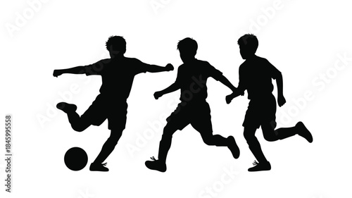 Silhouette of three boys playing soccer with a ball demonstrating movement and athleticism