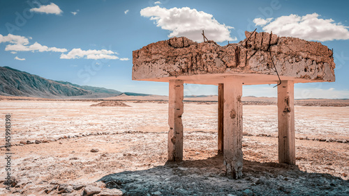 Photos Abandoned Concrete Structure on a Dry Desert Flat