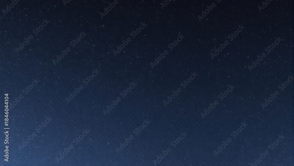 Fototapeta premium A dark blue gradient background speckled with tiny white dots, evoking a night sky