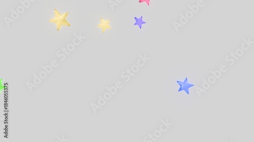 回転しながら落下するカラフルな星