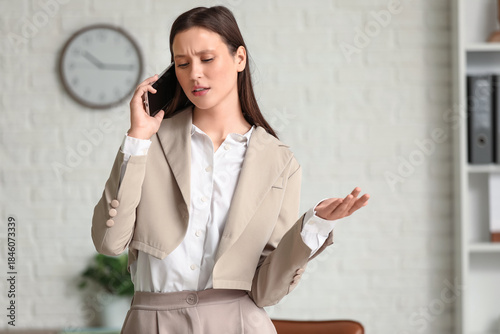 Young businesswoman talking...