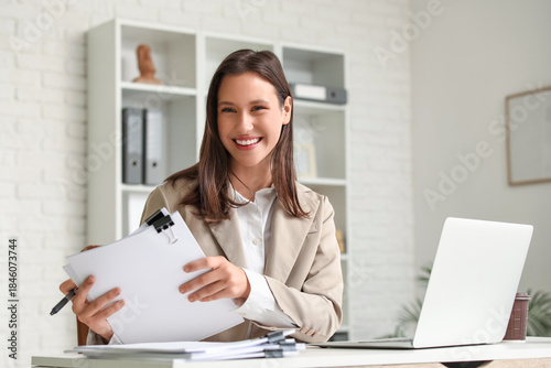 Young businesswoman working...