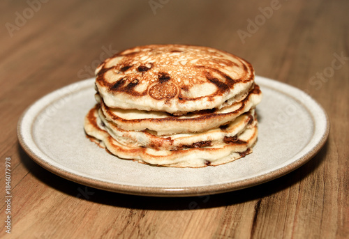 Stack of chocolate chip pancakes on a plate
