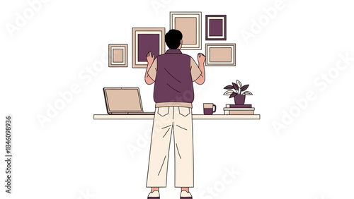 Man hanging picture frames on the wall, home decor and art in the interiors no comma or other
