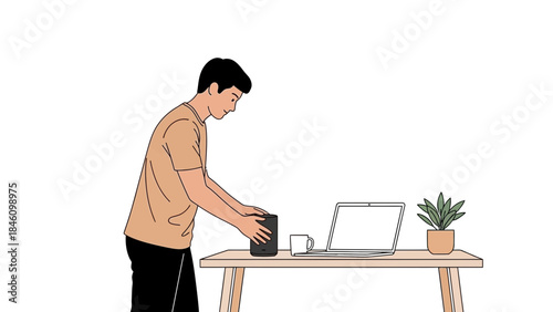 Man setting something up in his home office with a laptop, plant, and smart speaker at work