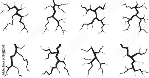 A collection of various stylized black crack patterns on a clean white background, depicting damage