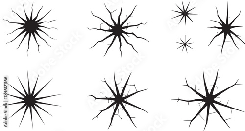 A compelling collection of six dark black crack patterns resembling shattered glass or impact marks on white