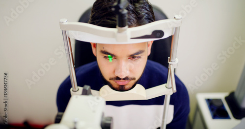 Slika na platnu Man, eye test and above with machine for optometry inspection, laser correction and lens procedure