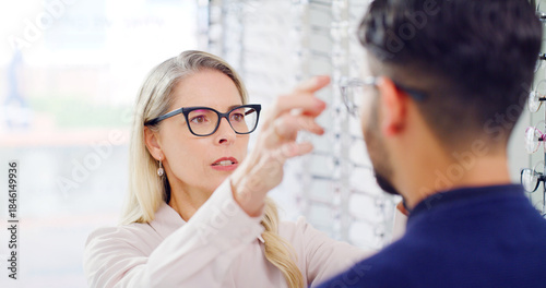 Optometry, choice or woman in shop with glasses, variety or assistance in eyewear option. Healthcare, people or optometrist in store with specs, eye wellness or optical selection in customer service