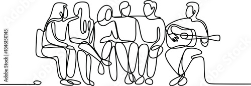 Group of people sitting and playing musical instruments together