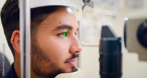 Fotografie Man, eye exam and lamp machine for optometry inspection, laser correction and cornea procedure