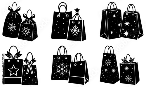 Black shopping bags with white snowflake and star patterns on white background snowflakes stars