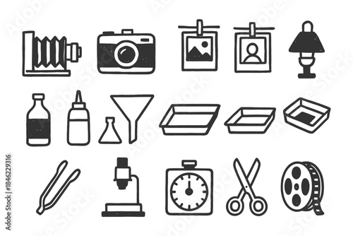 Vintage photography equipment: camera, film, developing tools, and more.