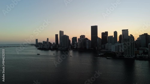 Wallpaper Mural Stabile shot of Miami city skyline with its high skyscrapers and helicopter flying over , POV drone view at the downtown district in USA metropolitan.  Torontodigital.ca