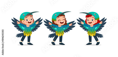Three happy Asian children playing joyfully in colorful bird costumes with big smiles