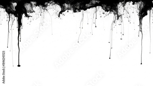 Black paint splatters and drips on a creating a messy border