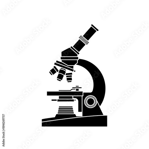 Silhouette of a microscope with a hand adjusting the focus for scientific investigation and