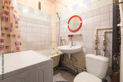 modern bathroom room with toilet and washing machine