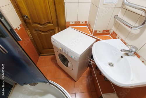modern bathroom room with toilet and washing machine