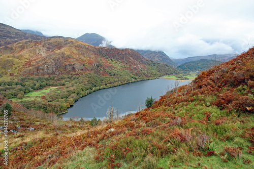 Llyn Dinas lake in Snowdonia Mountain Range near to Beddgelert, North Wales, on a wet and windy Autumn day with pouring rain