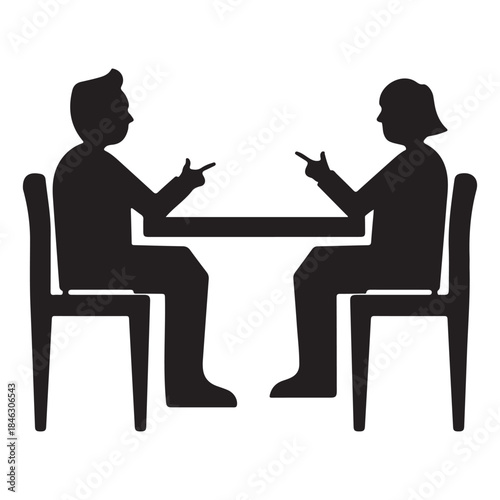  Two people sitting at a table having a discussion or argument silhouette