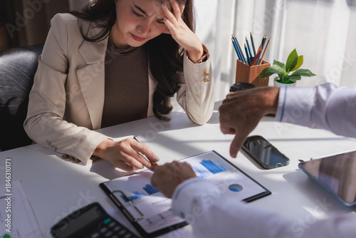 Businesswoman experiencing failure receiving negative performance feedback
