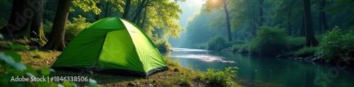 Green camping tent pitched near river in lush forest, peaceful, stake