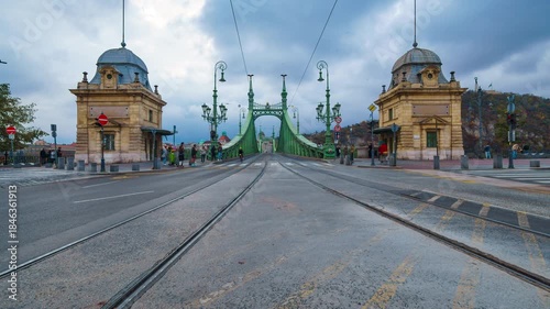 timelapse of city streets and road traffic and random people in Budapest, Hungary, view to the Liberty Bridge
