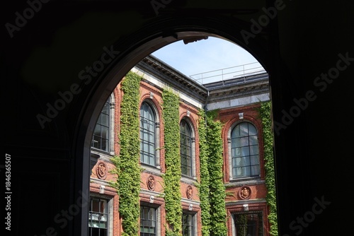 Ivy-covered courtyard facade of Kunsthal Charlottenborg in Copenhagen, Denmark