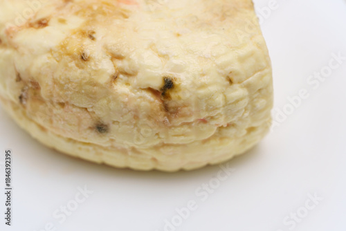 Cuadro en lienzo A piece of spoiled cheese is shown on a white plate