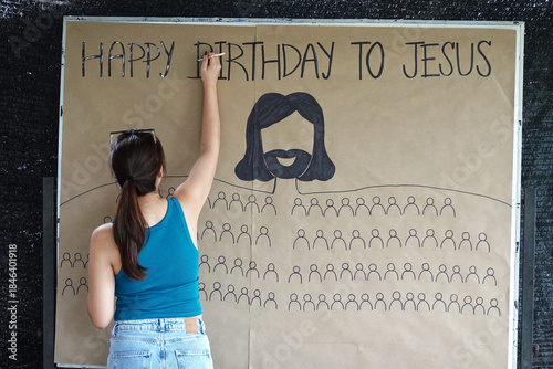 Woman Writing on Board Party Christmas Season  HAPPY BIRTHDAY TO JESUS