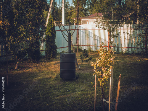 Garbage incinerator in the yard of a rural house