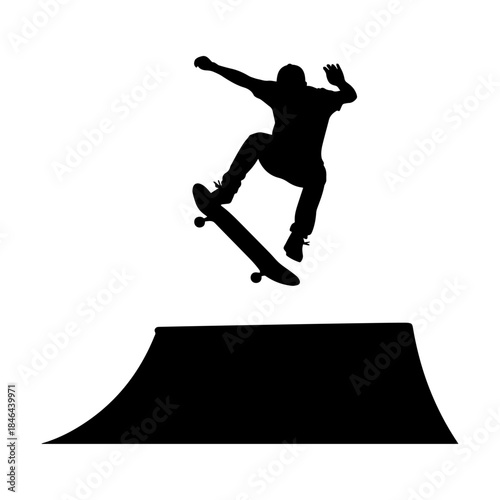 Silhouette of skateboarder performing trick on ramp.