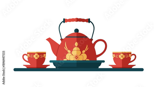 Vintage red teapot with ornate design and matching cups on tray