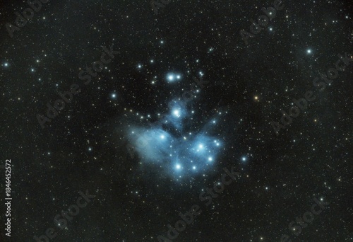Fotografie Stunning view of the Pleiades star cluster (M45) with blue reflection nebula glo