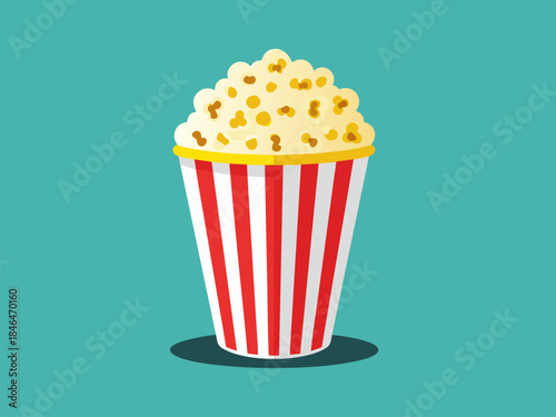 A classic red and white striped bucket overflowing with freshly popped popcorn.