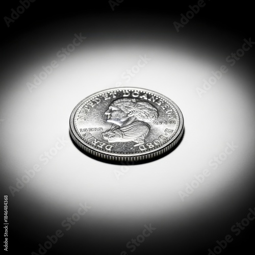 Vintage Canadian Dollar Coin Under Dramatic Lighting