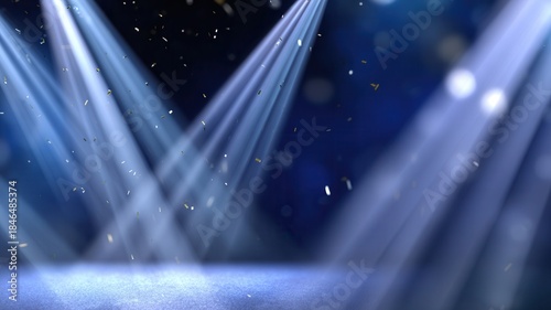 Empty stage illuminated by bright spotlights, glowing particles falling a with bokeh celebratory effect